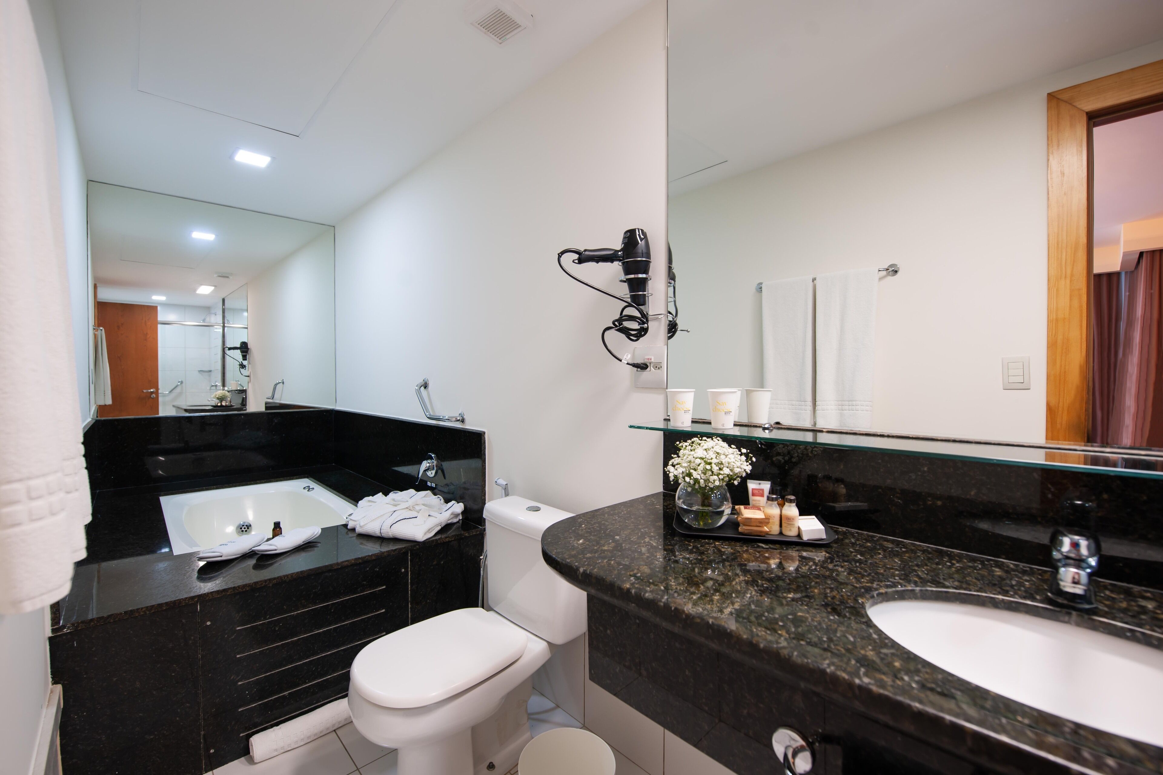 suite, 1 queen bed | bathroom | shower, rainfall showerhead, eco-friendly toiletries, hair dryer