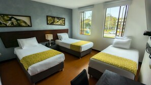 Standard Triple Room | Premium bedding, down duvets, in-room safe, individually decorated - Hotel Charlotte Suite 26 (Bogotá)