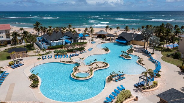 A resort with a large swimming pool, beach access, and palm trees. - Marriott's St. Kitts Beach Club (Basseterre)