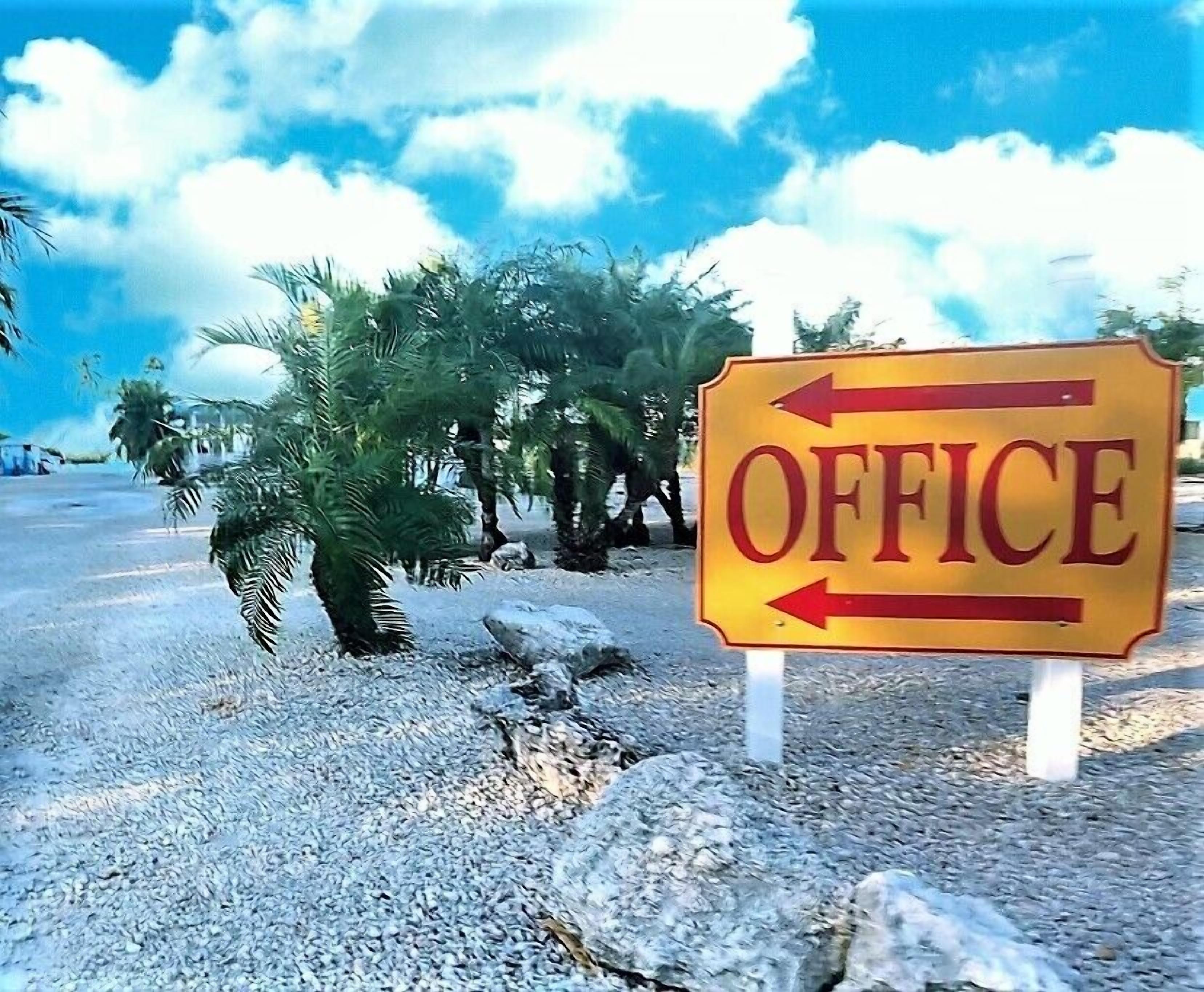 A sign with the word "OFFICE" and two arrows pointing in opposite directions.