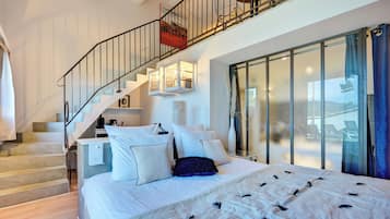 Family Suite (Duplex) | 1 bedroom, in-room safe, individually decorated, iron/ironing board