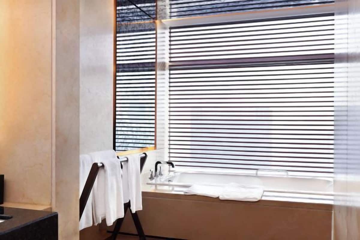 Bathroom | Separate bathtub and shower, free toiletries, hair dryer, slippers