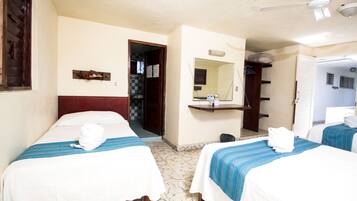 Triple Room with Fan only and No special view | Iron/ironing board, bed sheets