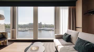 One Bedroom Superior Suite with City View | Living area | 55-inch flat-screen TV with digital channels, TV, DVD player