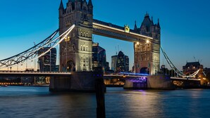 A large, historic bridge with two towers and a suspension design, spanning a wide river. - DoubleTree by Hilton Hotel London -Tower of London (London)