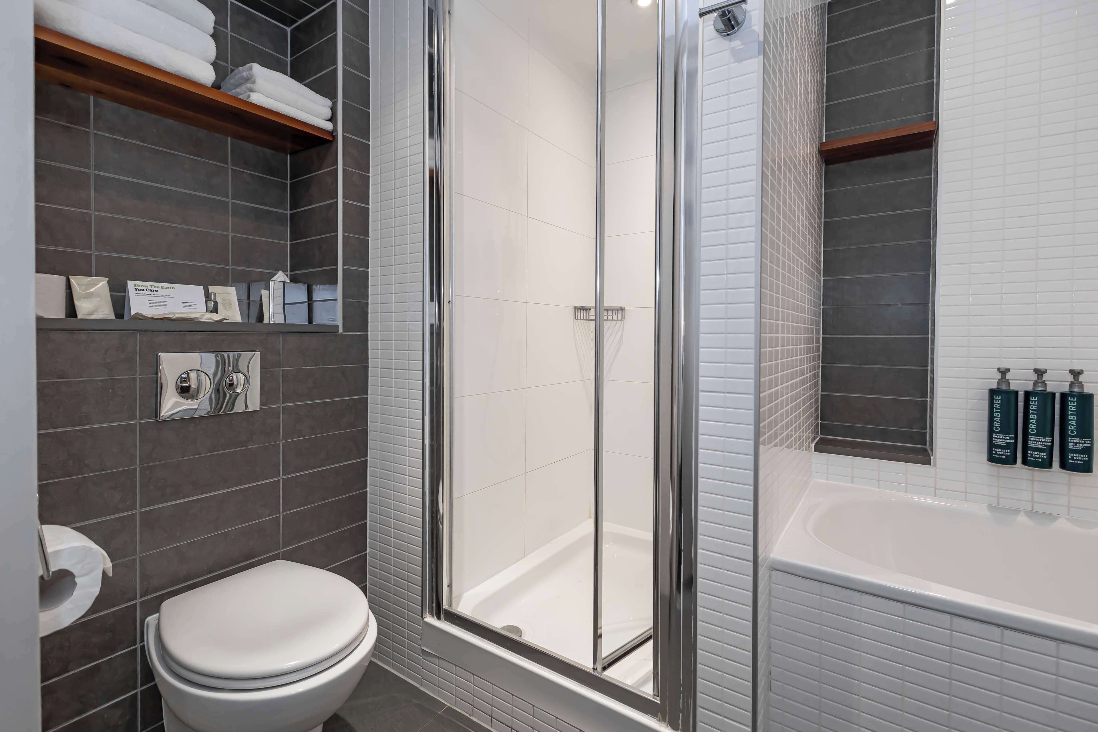 suite, 1 king bed, non smoking (atrium) | bathroom shower