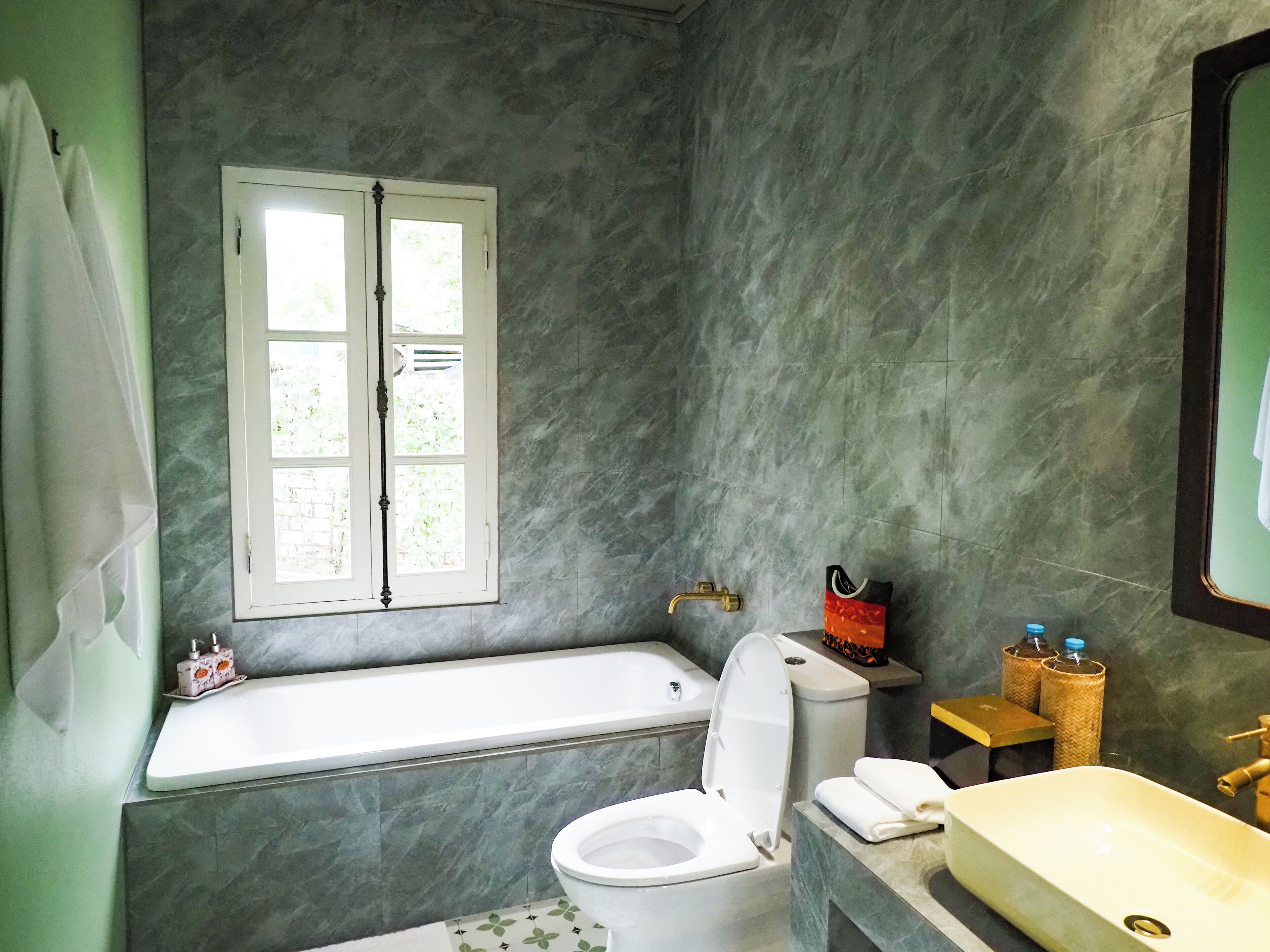 lotus pond pavilion | bathroom | shower, hair dryer, slippers, towels