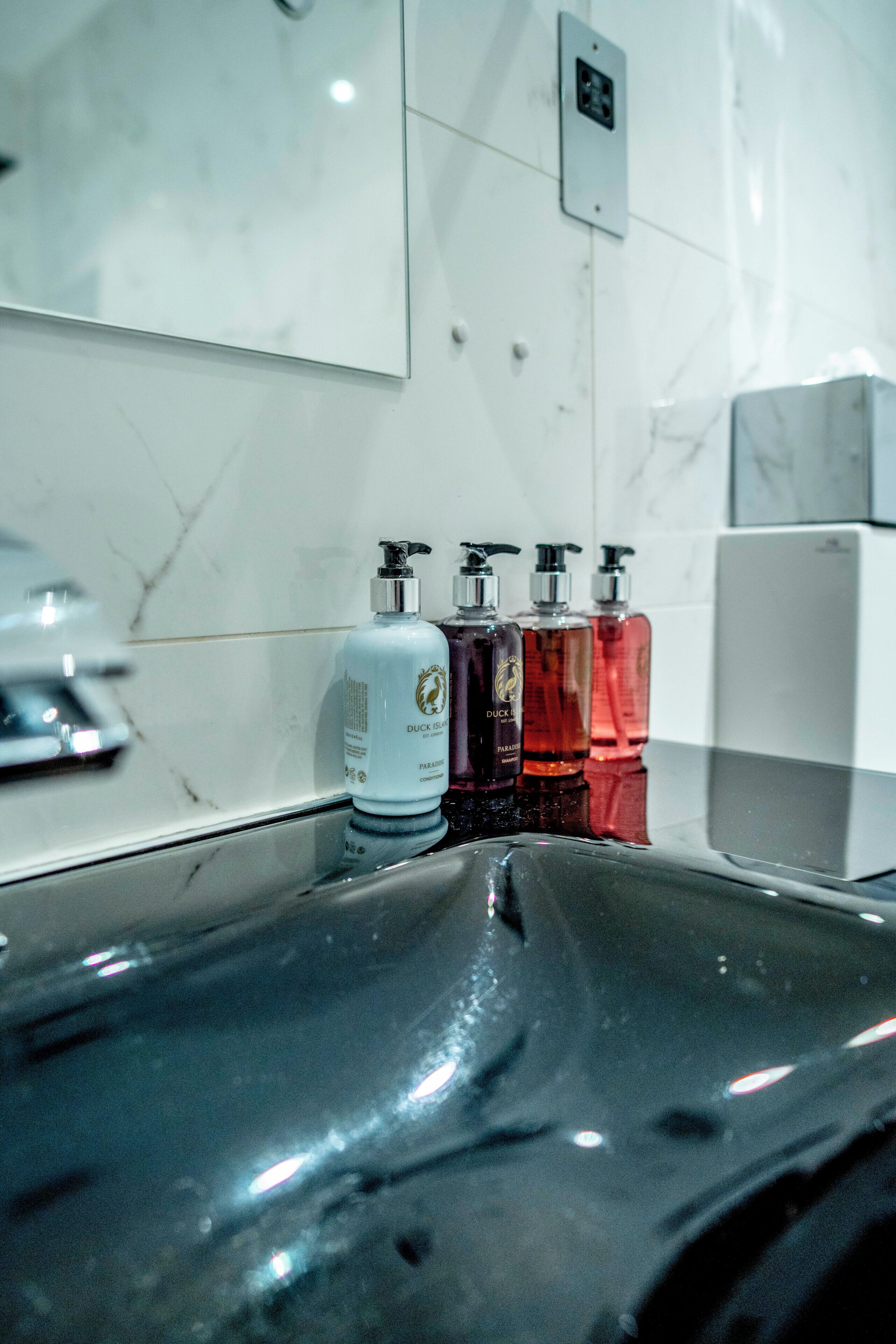 king deluxe guest room | bathroom | eco-friendly toiletries, hair dryer, towels, soap