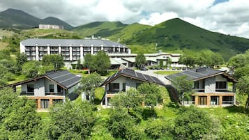 Set amidst lush mountains, this hotel offers scenic views from large windows.