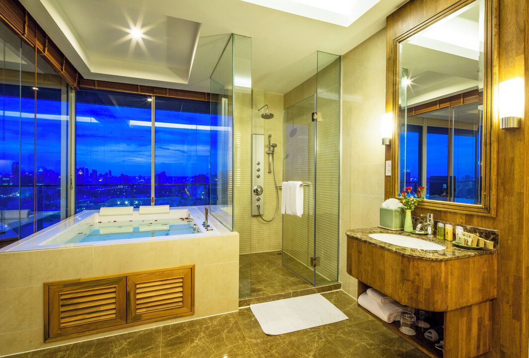 jacuzzi suite | bathroom | separate bathtub and shower, rainfall showerhead, free toiletries