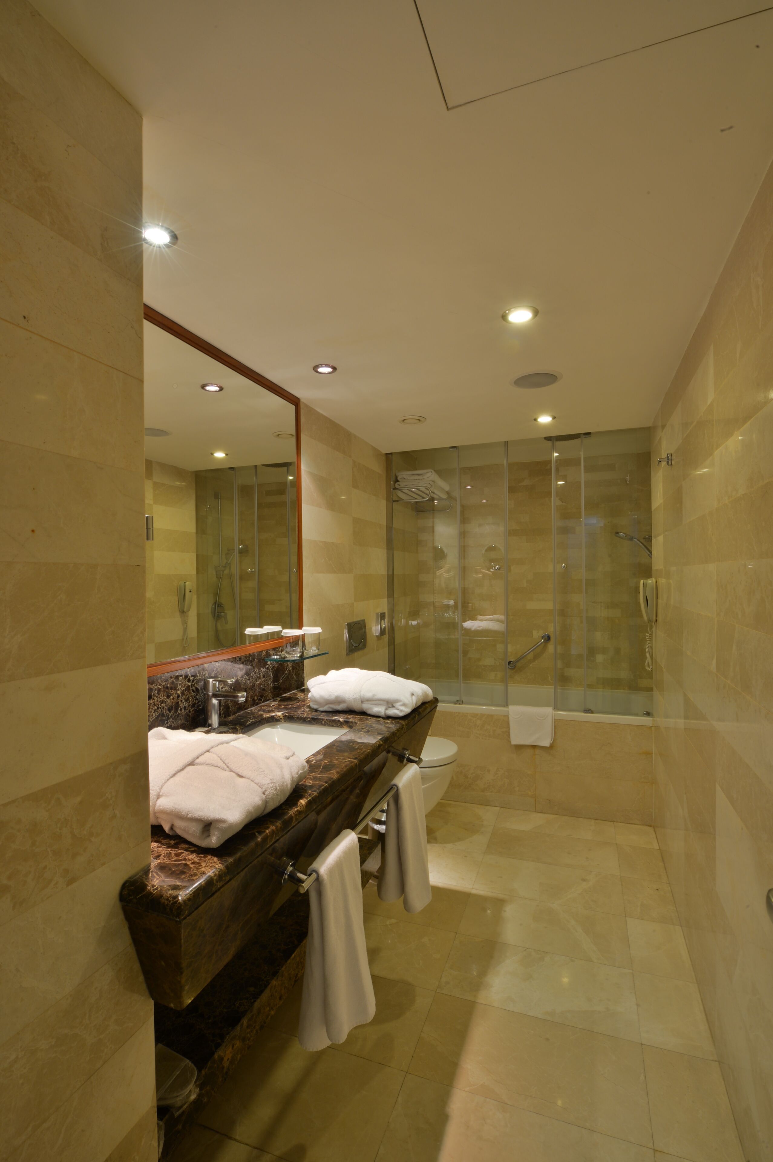 deep-soaking bathtub, free toiletries, hair dryer, bathrobes