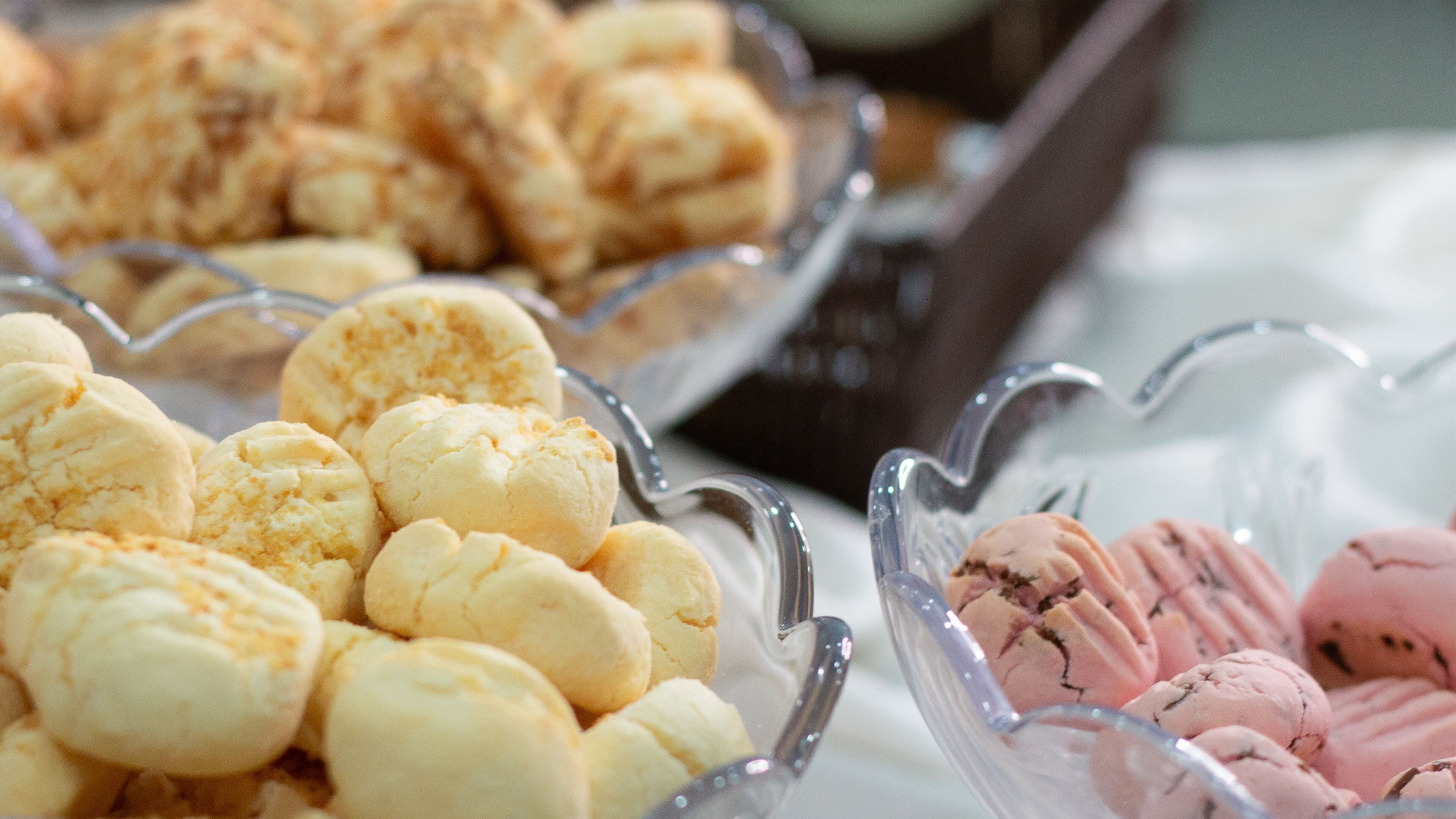 A buffet with various desserts including pastries and ice cream.