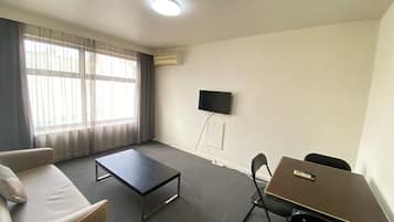 Appartement 1 chambre | Salle de séjour | Téléviseur ACL