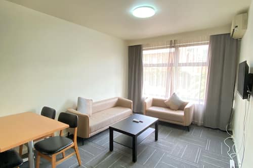 Two Bedroom Apartment - Gipps Street Building | Living area | LCD TV