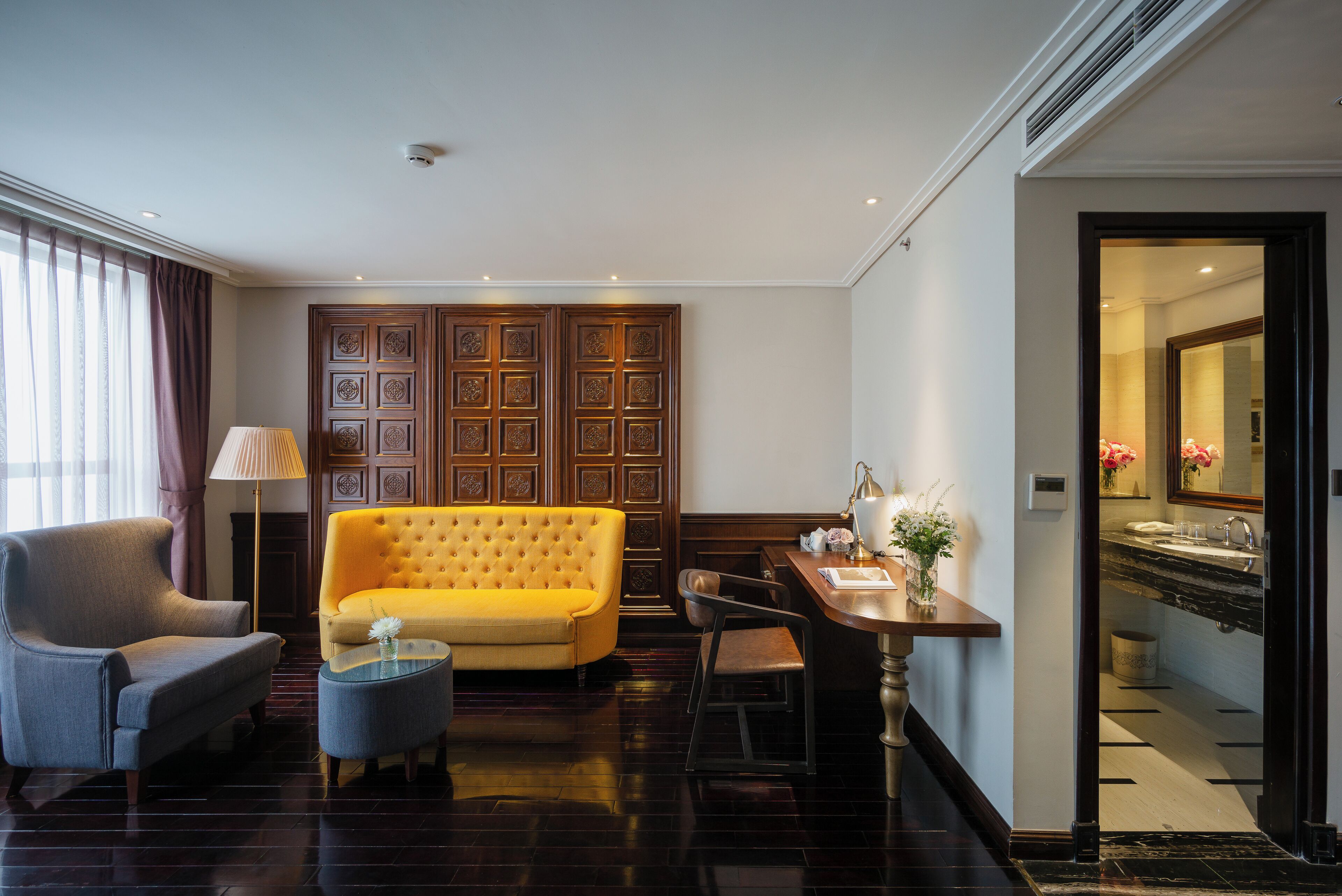 haute couture suite room | living area | 32-inch lcd tv with satellite channels, tv, fireplace