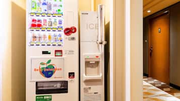 A vending machine with a variety of drinks and a water dispenser, labeled "Best Selection" and "ICB".