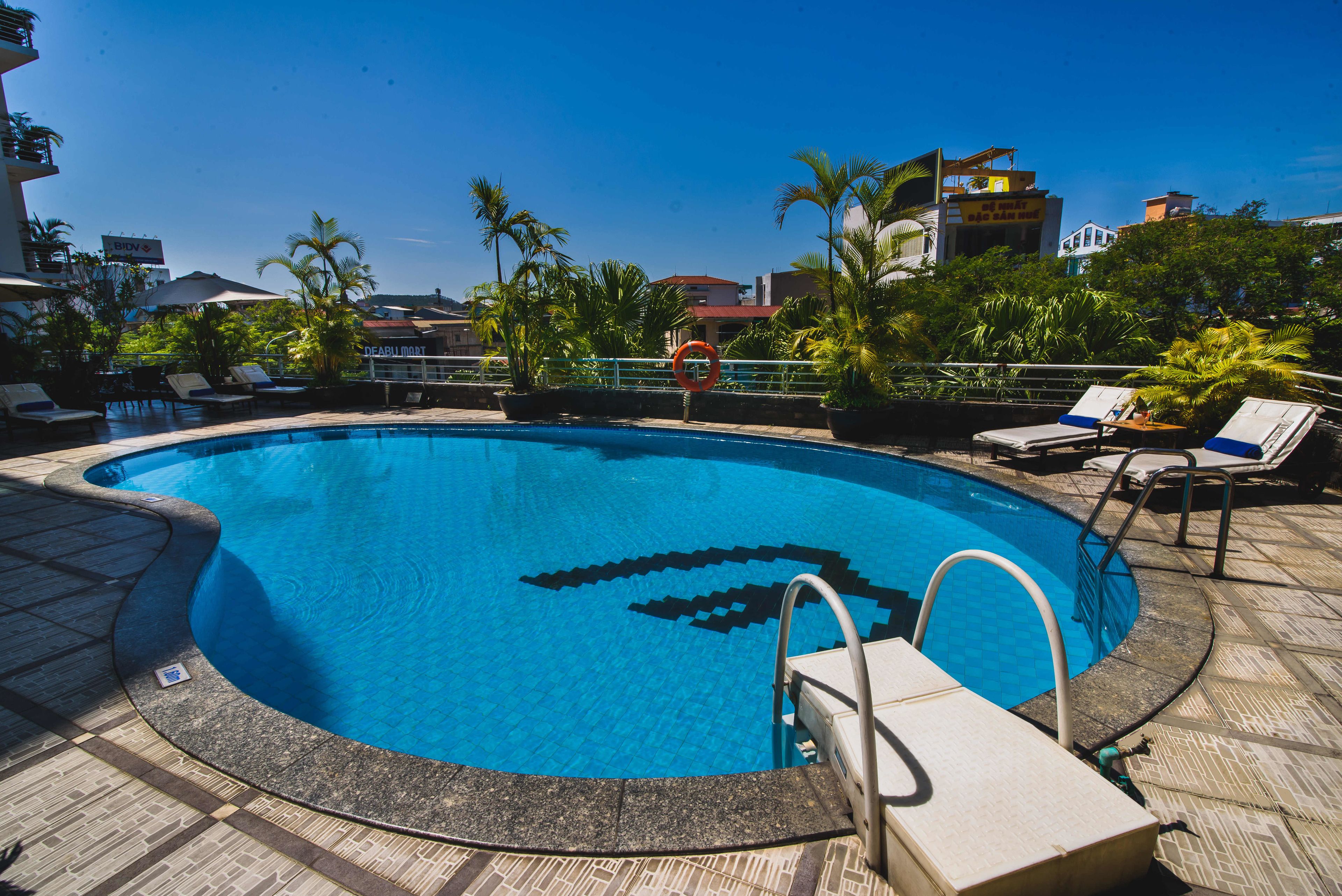 outdoor pool, pool umbrellas, pool loungers