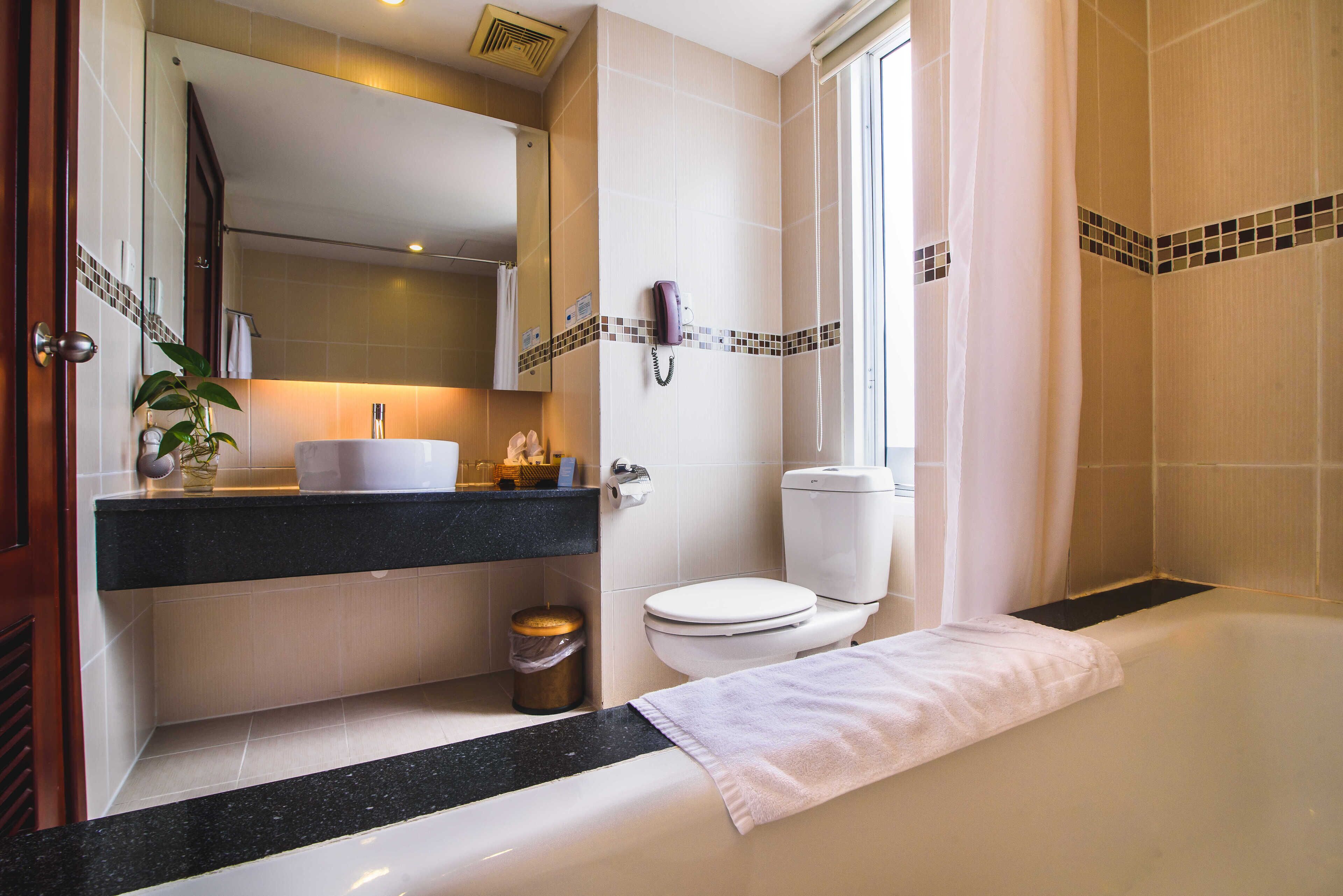 deep-soaking bathtub, rainfall showerhead, designer toiletries