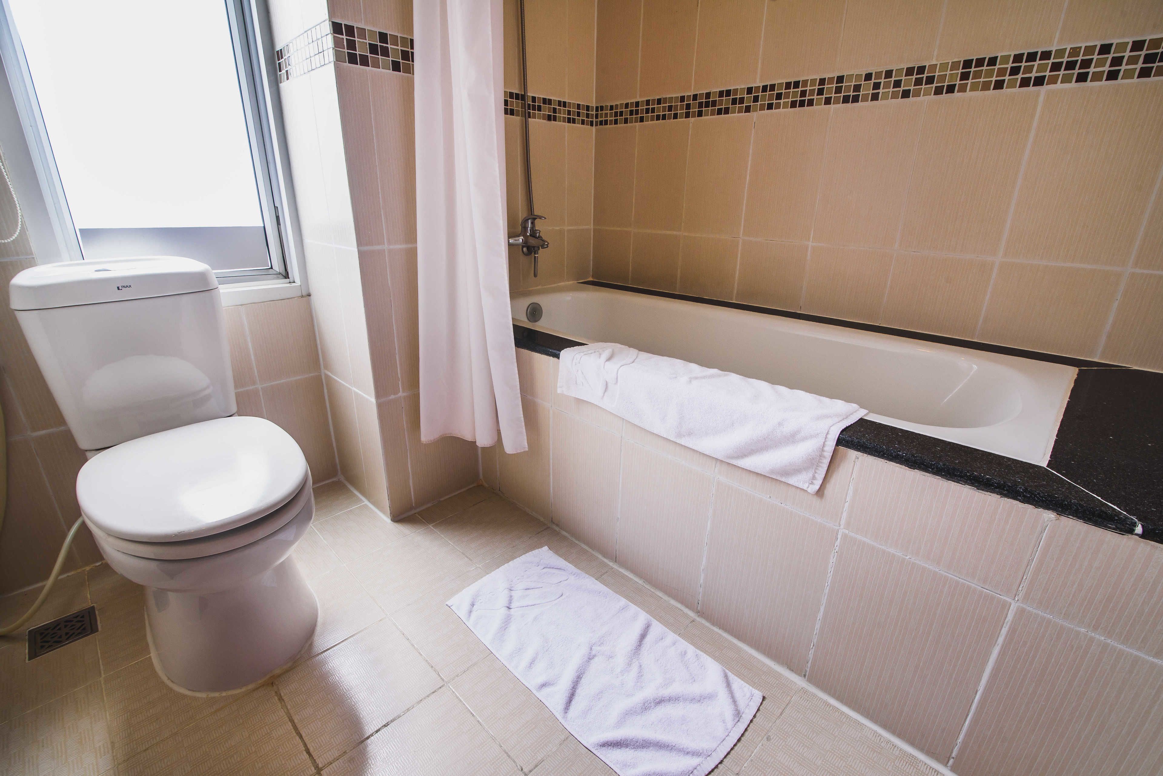 deep-soaking bathtub, rainfall showerhead, designer toiletries