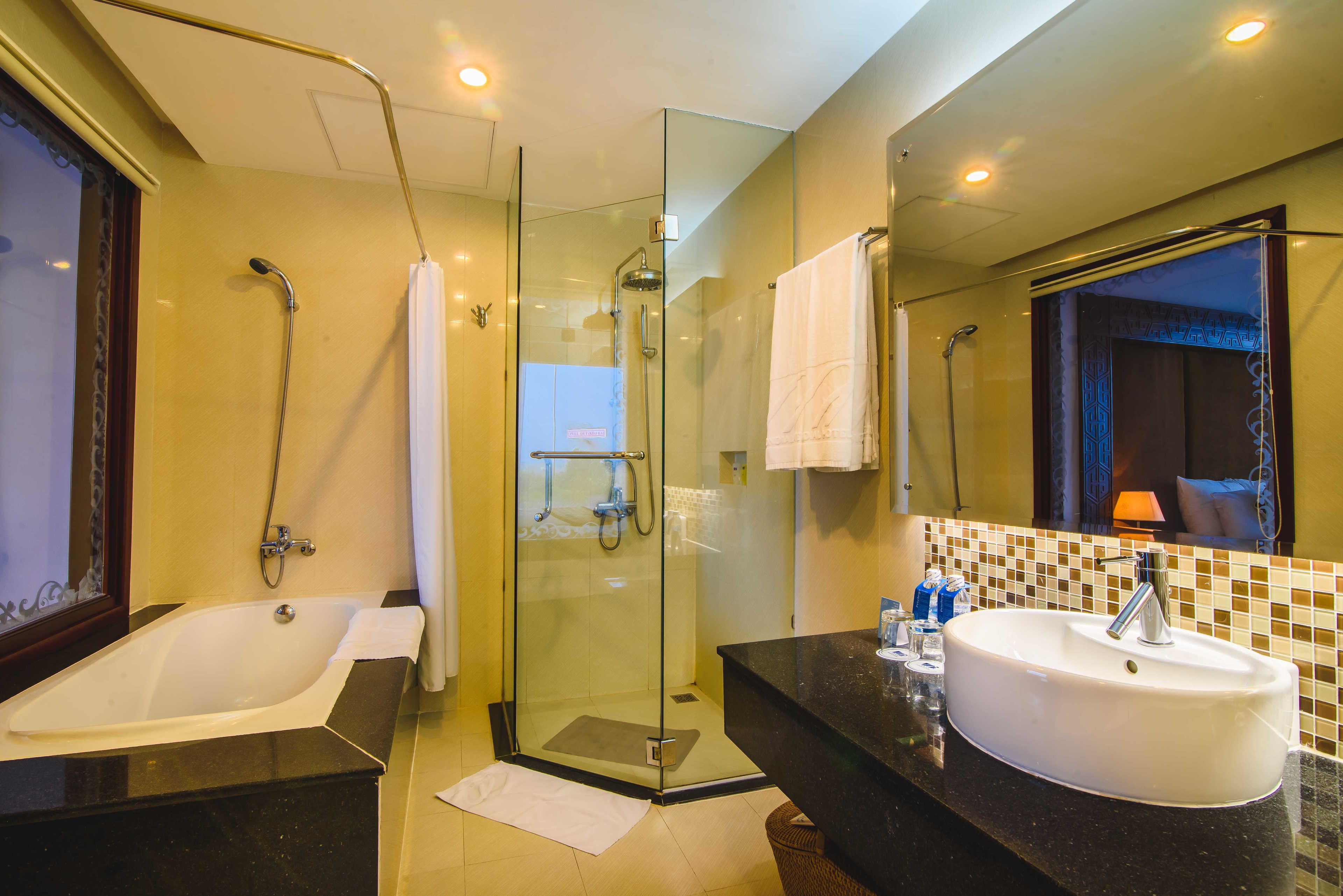 panoramic suite, river view | bathroom | deep-soaking bathtub, rainfall showerhead, designer toiletries