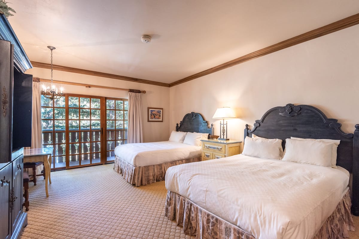 deluxe room, 2 queen beds | down duvets, in-room safe, desk, iron/ironing board