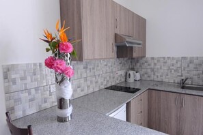 Fridge, stovetop, electric kettle, cookware/dishes/utensils - Cosmelenia Hotel Apartments (Ayia Napa)