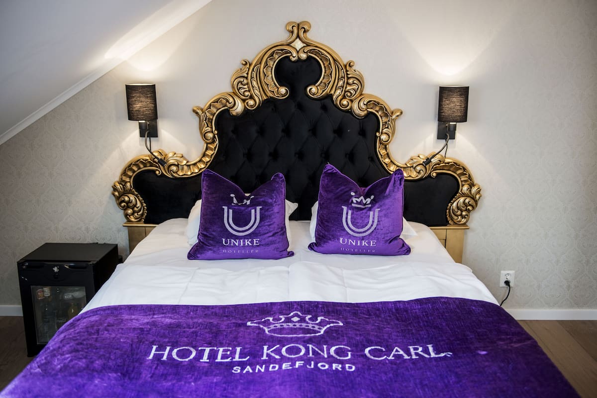 Deluxe eenpersoonskamer | Luxe beddengoed, een minibar, een bureau, een strijkplank/strijkijzer