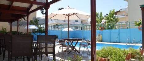 Seasonal outdoor pool, open 9:30 AM to 9:30 PM, pool umbrellas