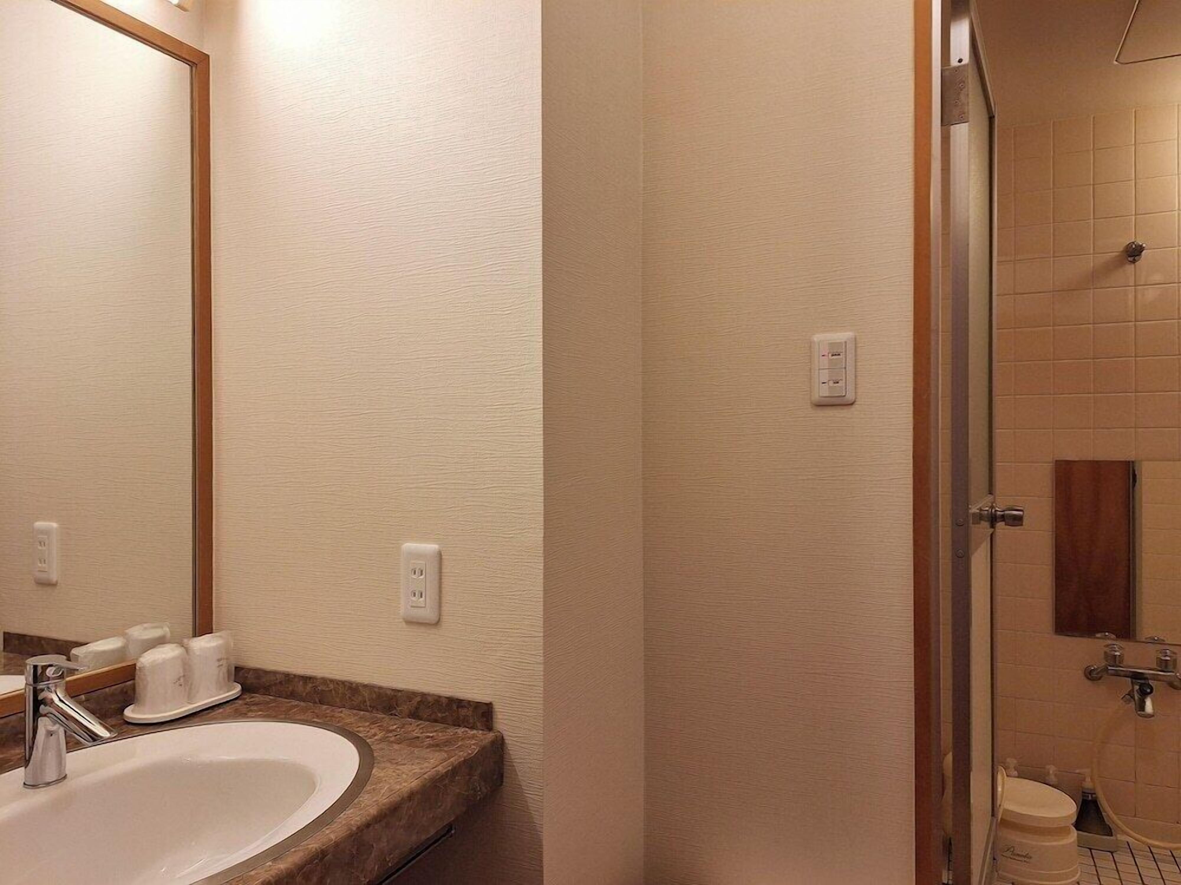 Bathroom | Combined shower/bathtub, free toiletries, hair dryer, slippers