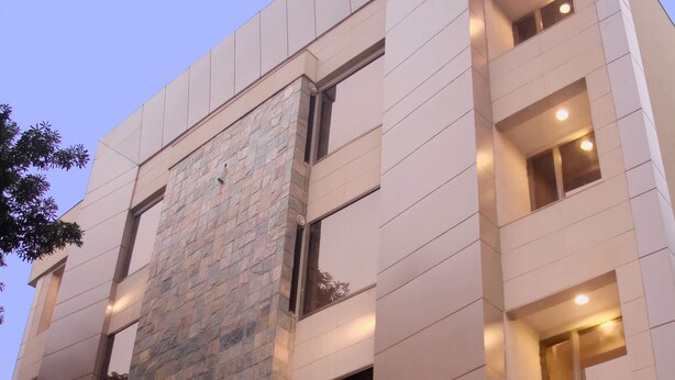 A modern building with a prominent sign for Sherwani Hotel. - Shervani Hotel Nehru Place (New Delhi)