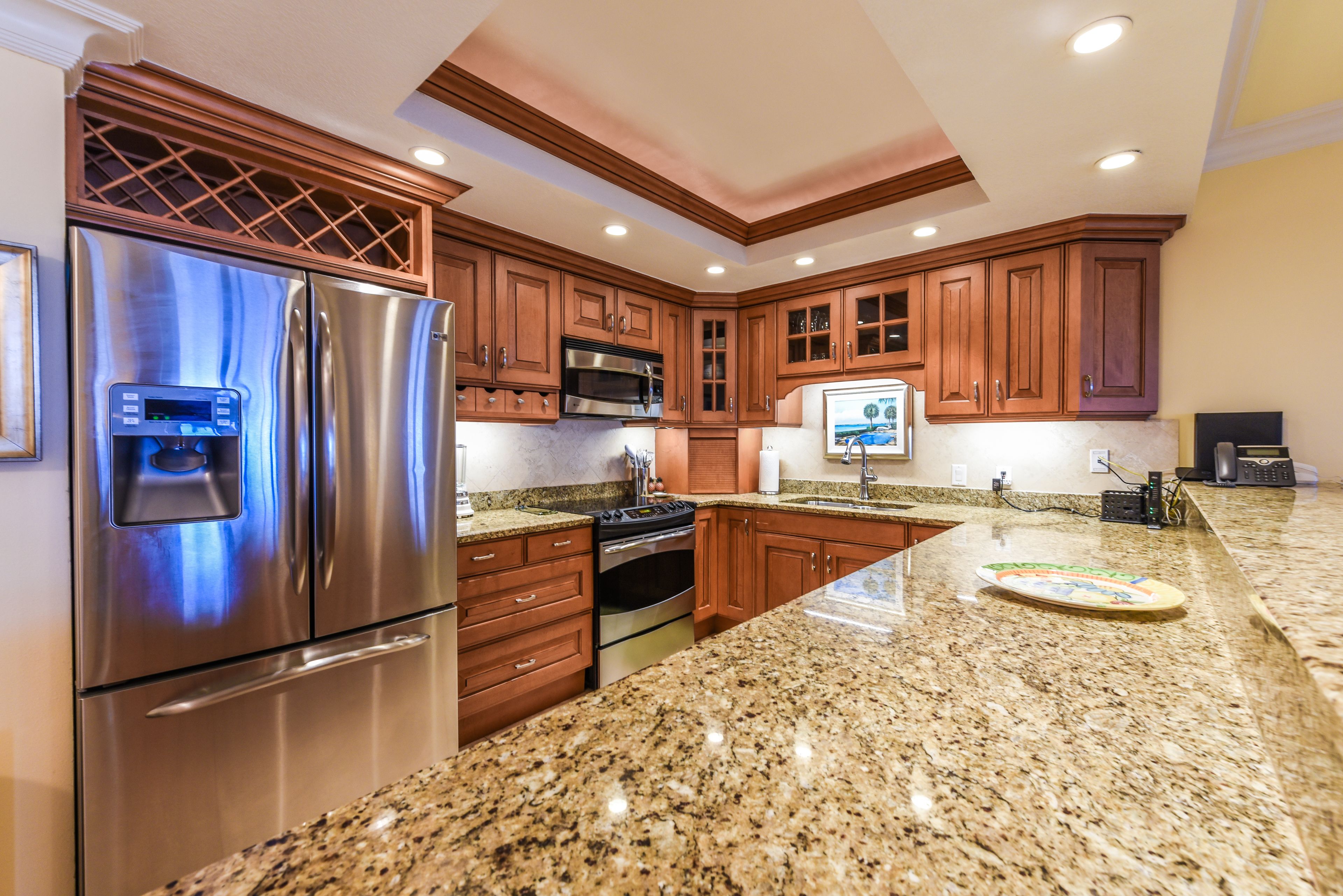 full-sized fridge, microwave, stovetop, dishwasher