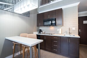 Suite, 1 King Bed with Sofa bed, Kitchen (Loft) | Private kitchen | Coffee/tea maker - Sandman Hotel & Suites Calgary South (Calgary)