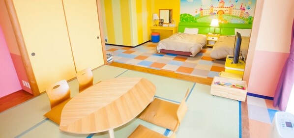 A children's room with a bed, a desk, a chair, and a colorful checkered floor. - Diamond Setouchi Marine Hotel (Tamano)