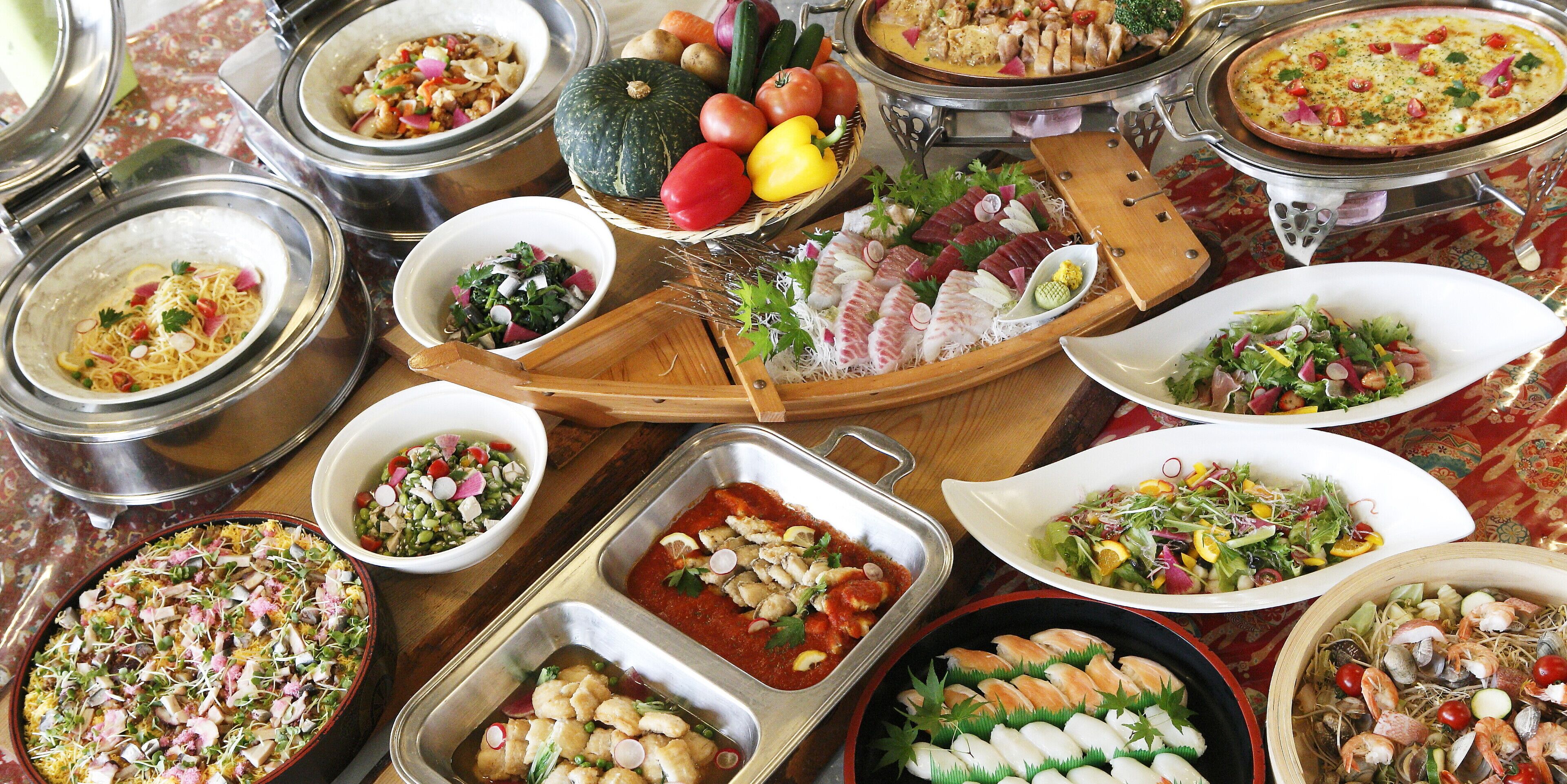 A variety of dishes and food items displayed on a table.