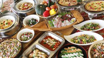 A variety of dishes and food items displayed on a table.