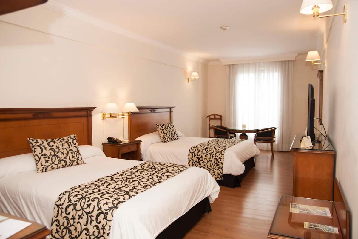 Ropa de cama de alta calidad y minibar