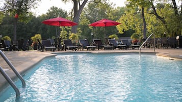 Seasonal outdoor pool, open 9:00 AM to 9:00 PM, pool umbrellas