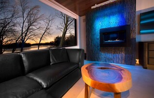 Deluxe Room | Living area | 55-inch TV with cable channels, iPod dock