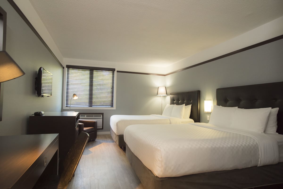 Standard Room, 2 Queen Beds | 1 bedroom, individually furnished, blackout drapes, iron/ironing board
