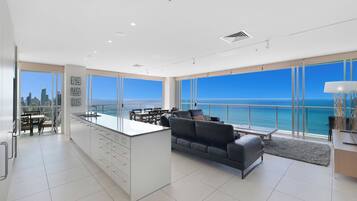 Four Bedroom Ocean View Apartment | Living area | 42-cm flat-screen TV with cable channels, TV, DVD player