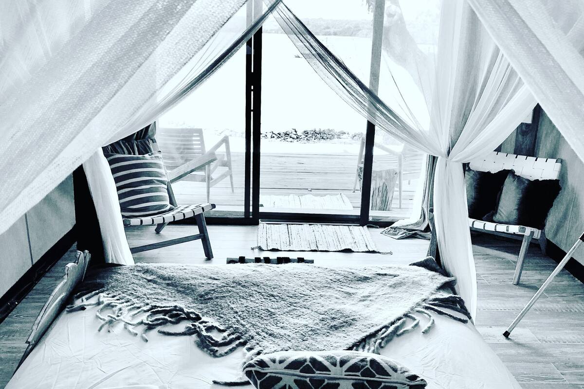 luxury tent, 1 queen bed, ocean view, oceanfront | 1 bedroom, premium bedding, individually decorated