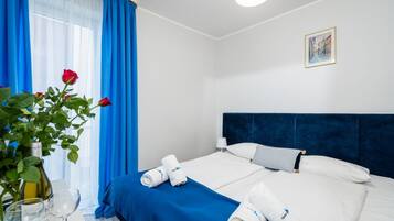 Down comforters, pillowtop beds, in-room safe, desk