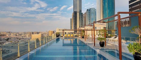 Outdoor pool, pool umbrellas, sun loungers