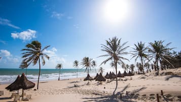 On the beach, sun loungers, beach umbrellas, beach towels