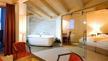 Deluxe Suite, 1 Double Bed, Bathtub | Down comforters, minibar, in-room safe, individually decorated