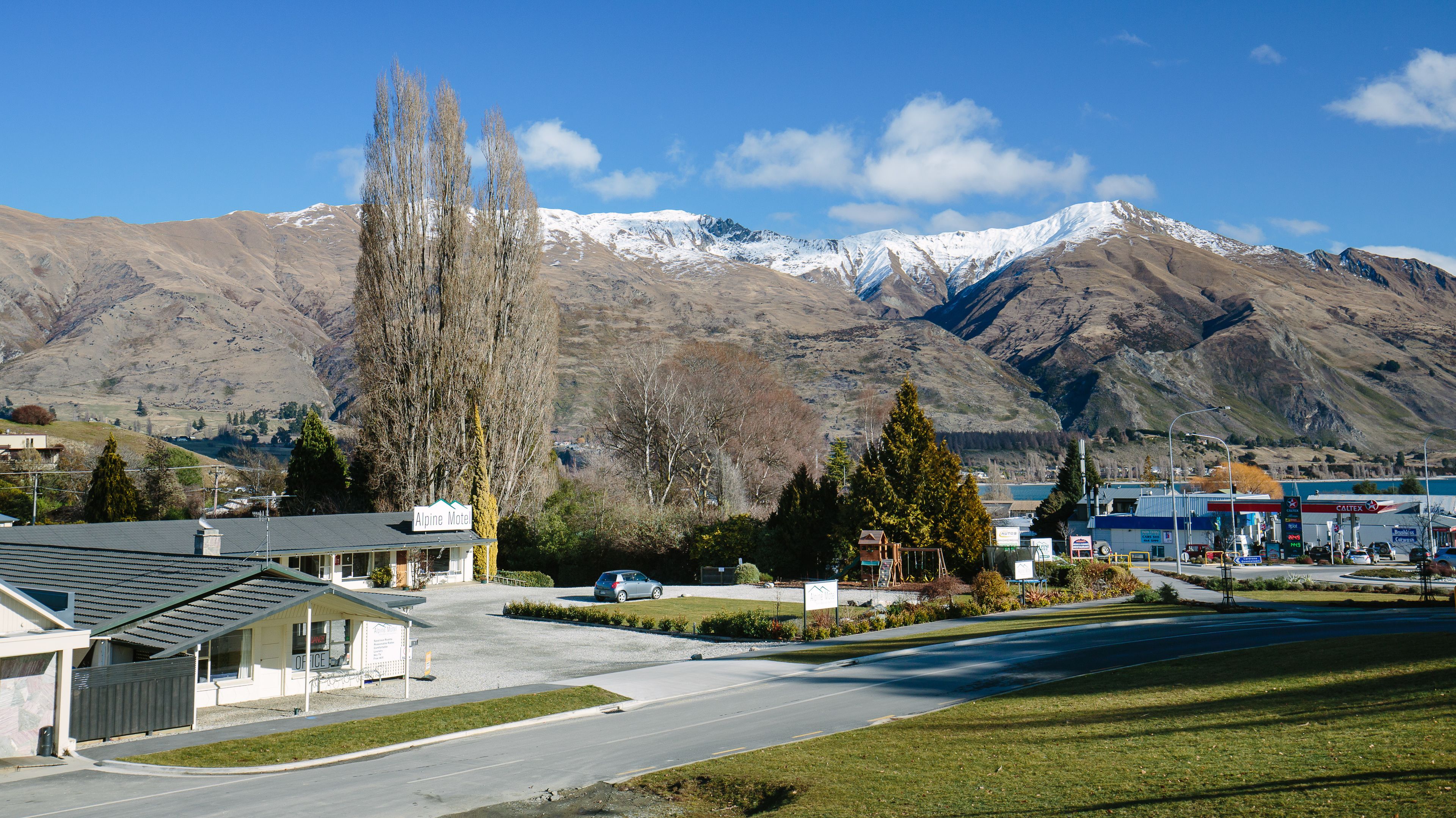 A motel with a view of snow-capped mountains.