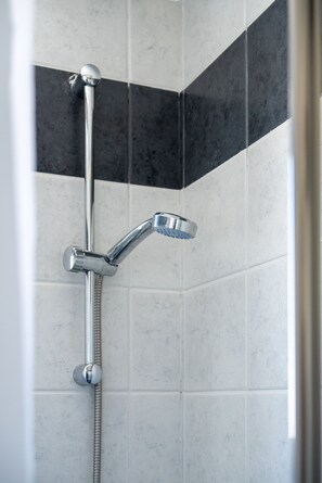 Shower, free toiletries, hair dryer, towels
