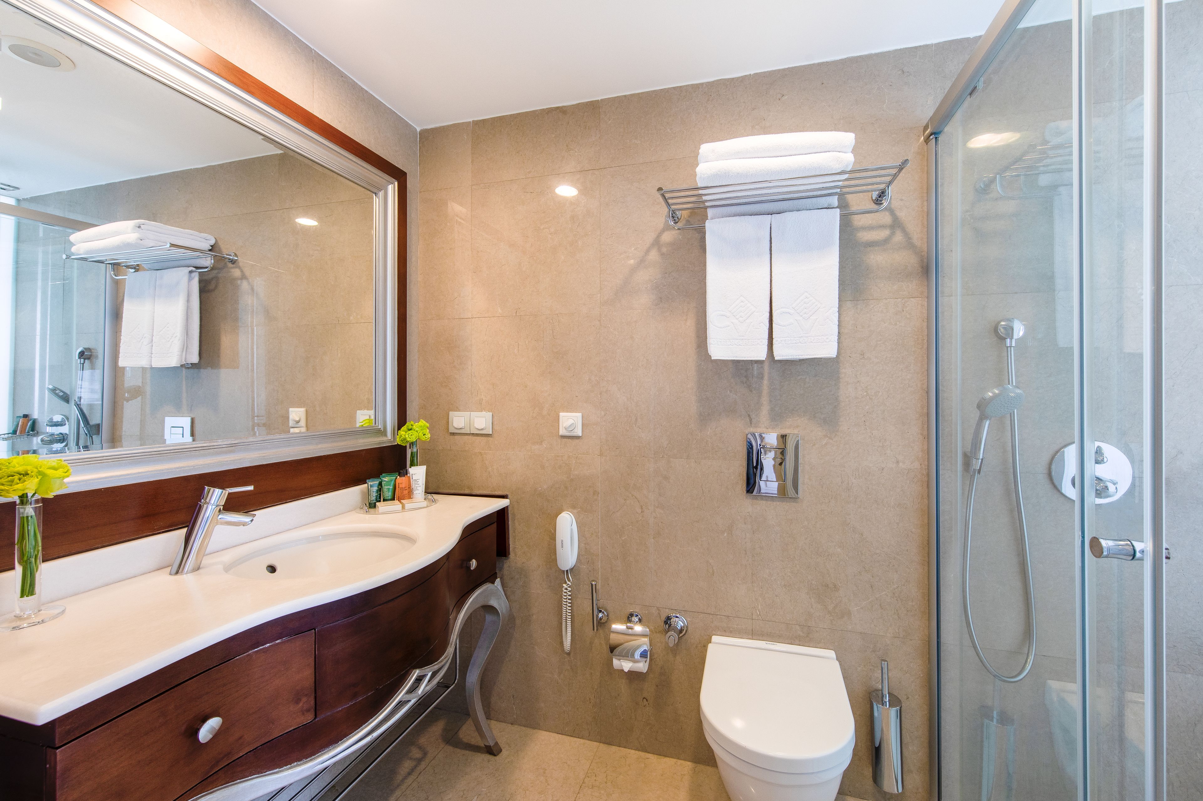 Shower, hair dryer, slippers, towels
