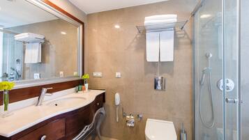 Shower, hair dryer, slippers, towels