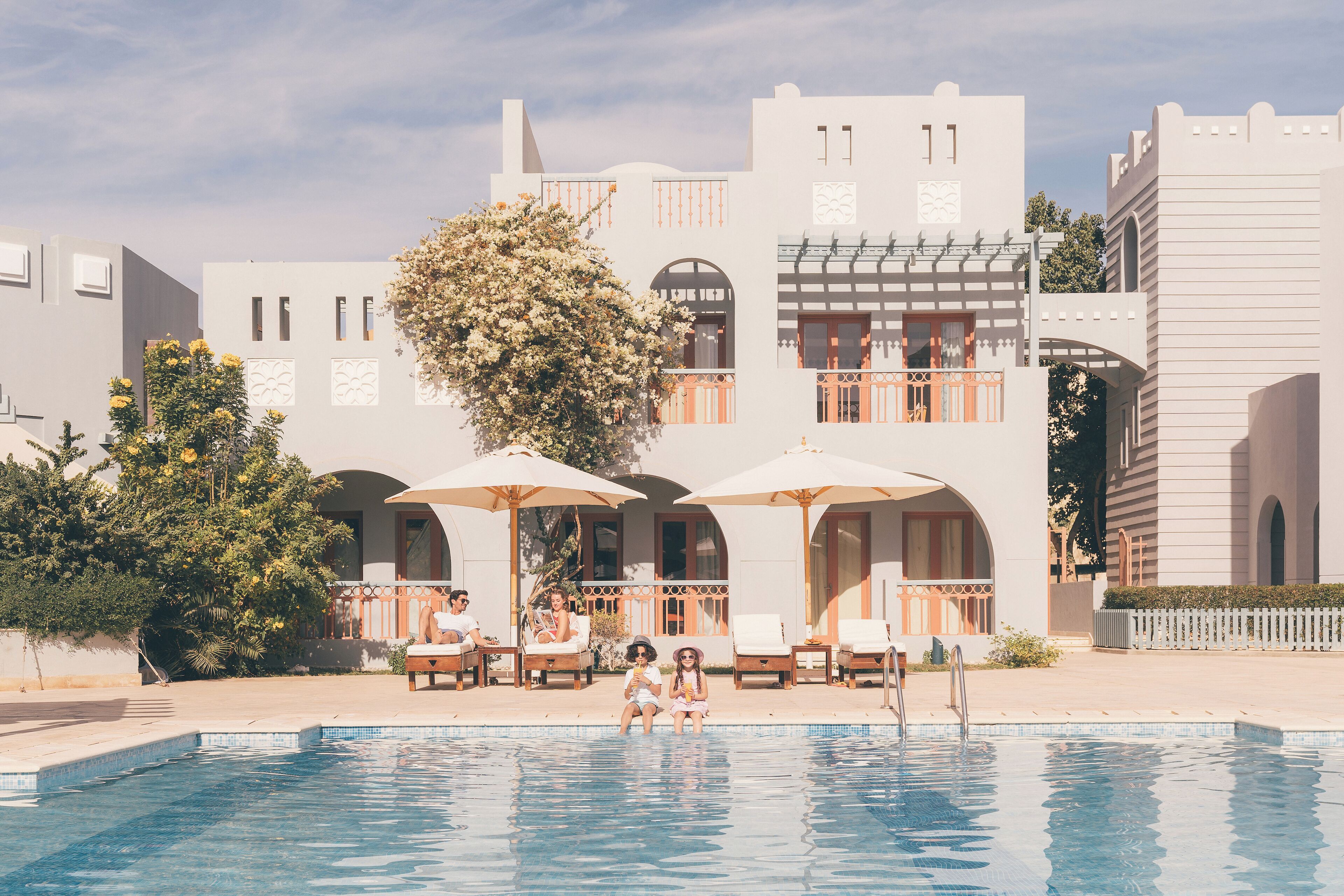 outdoor pool, pool umbrellas, pool loungers